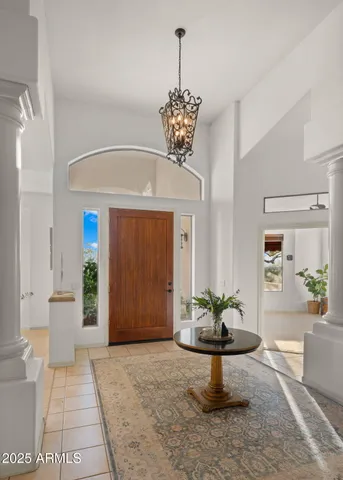 a kitchen with stainless steel appliances kitchen island granite countertop a table and chairs in it