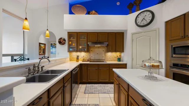 a kitchen with a refrigerator and a sink