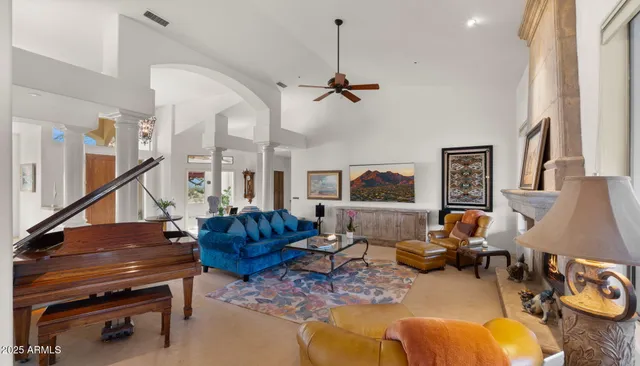 an aerial view of a house with a yard and swimming pool
