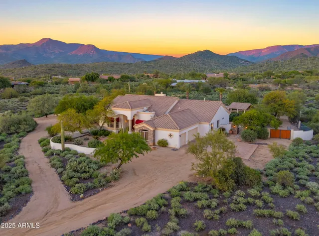 an aerial view of house with an outdoor space and street view