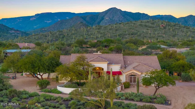 an aerial view of a house with a garden