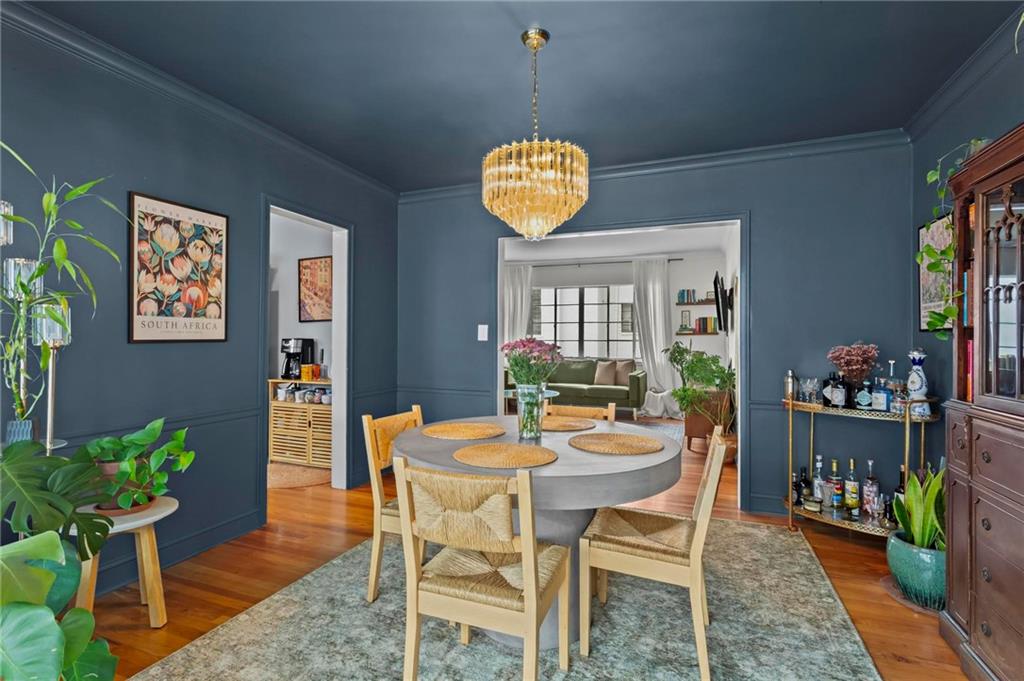 1120 Briarcliff Road Northeast, Unit 3 Atlanta, GA 30306 - Photo 13 of 27 a dining room with furniture and wooden floor