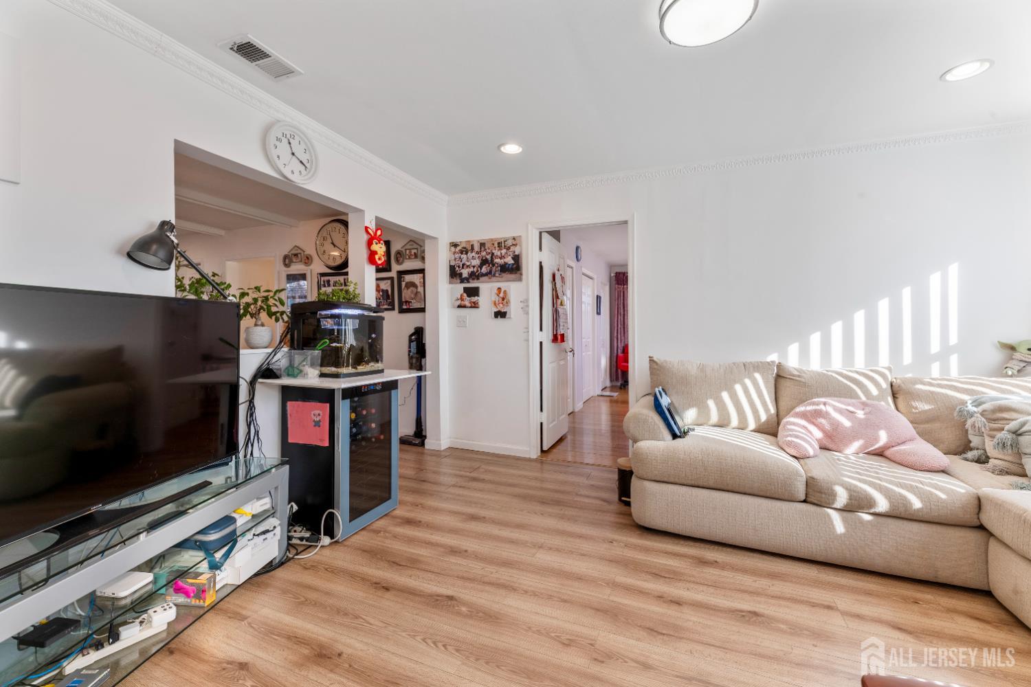 46 Runyon Avenue Edison, NJ 08817 - Photo 12 of 48 a living room with furniture and a flat screen tv