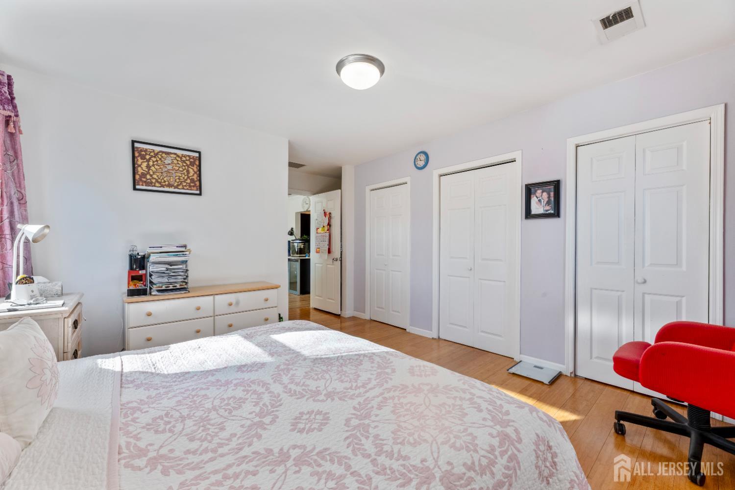 46 Runyon Avenue Edison, NJ 08817 - Photo 16 of 48 a bedroom with a bed and a couch