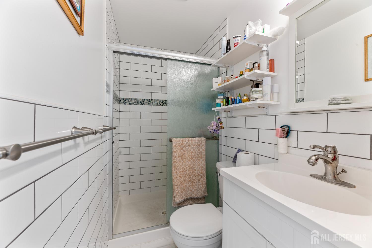 46 Runyon Avenue Edison, NJ 08817 - Photo 18 of 48 a bathroom with a sink a toilet and shower