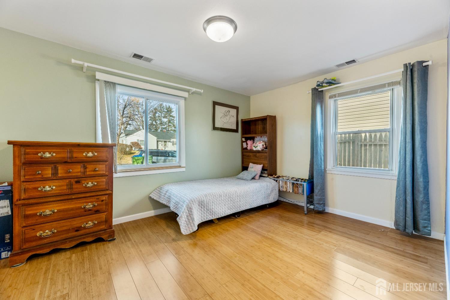 46 Runyon Avenue Edison, NJ 08817 - Photo 19 of 48 a bedroom with a bed and a dresser