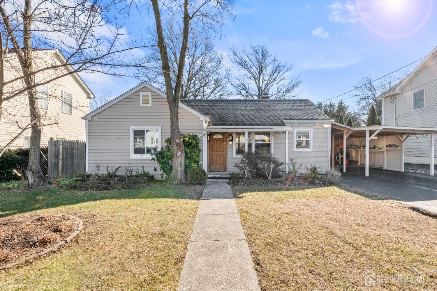 46 Runyon Avenue Edison, NJ 08817 - Photo 2 of 48 a view of a house with a yard covered with snow and plants