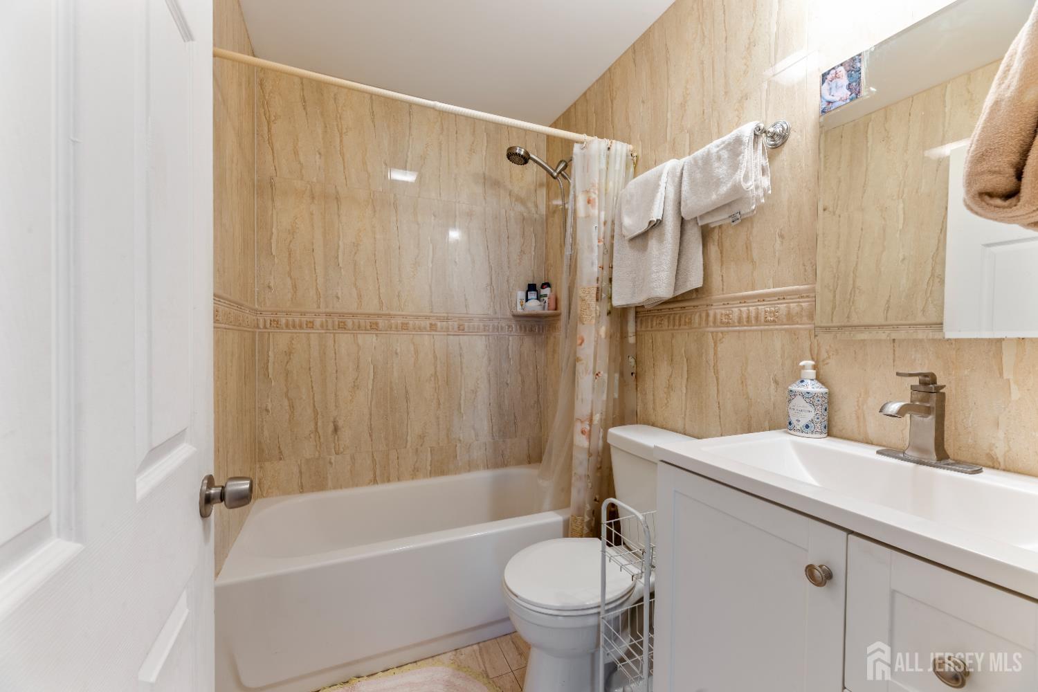 46 Runyon Avenue Edison, NJ 08817 - Photo 22 of 48 a bathroom with a sink toilet and shower