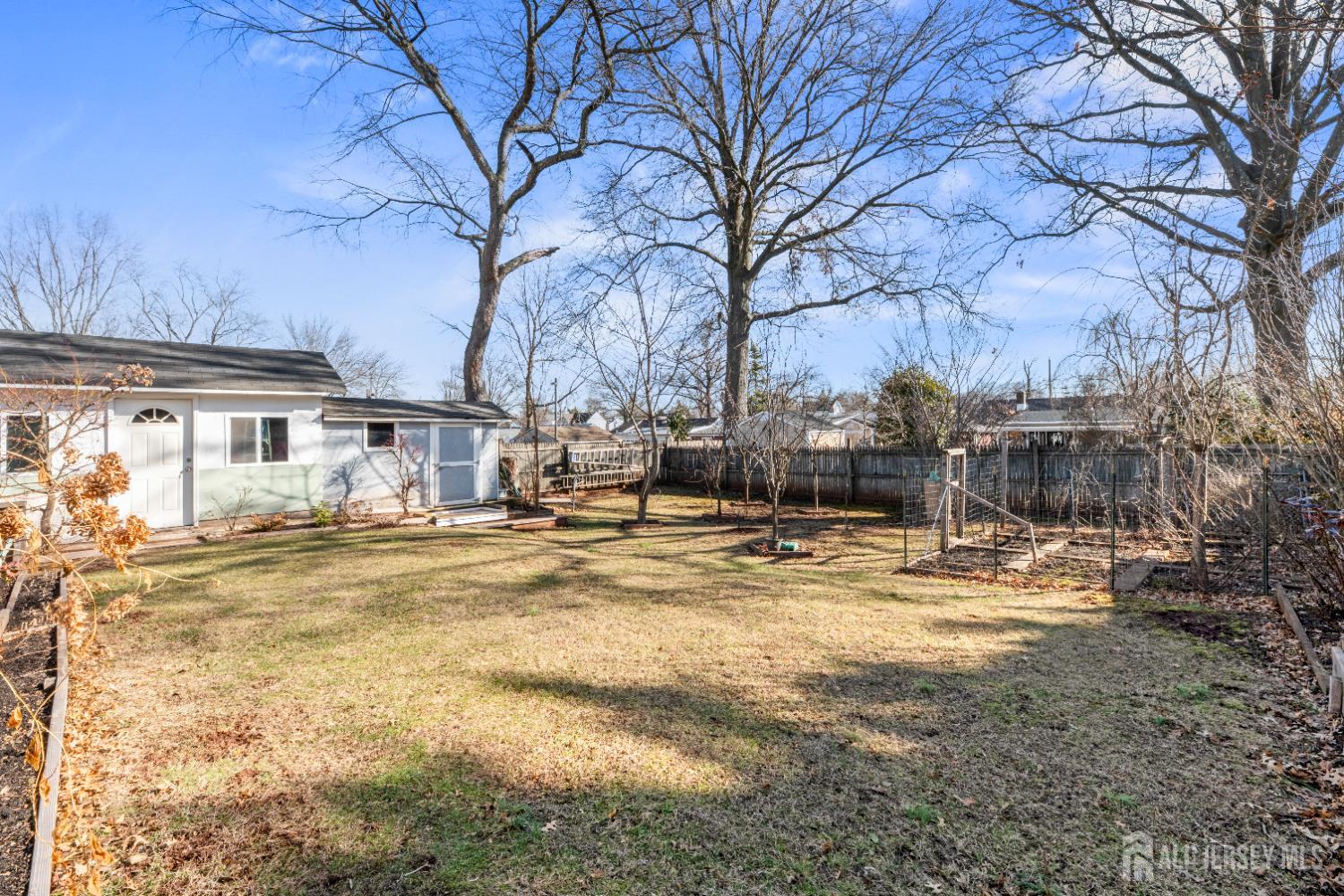 46 Runyon Avenue Edison, NJ 08817 - Photo 27 of 48 a view of a yard with a large tree