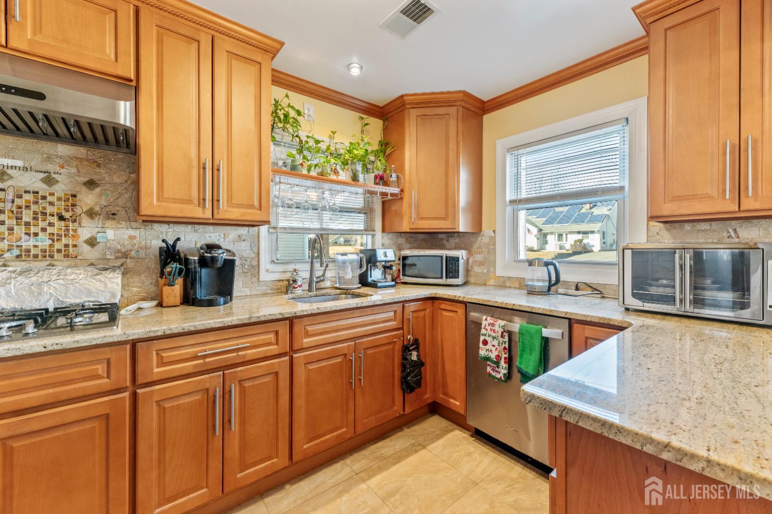 46 Runyon Avenue Edison, NJ 08817 - Photo 6 of 48 a kitchen with stainless steel appliances granite countertop a sink a stove and cabinets