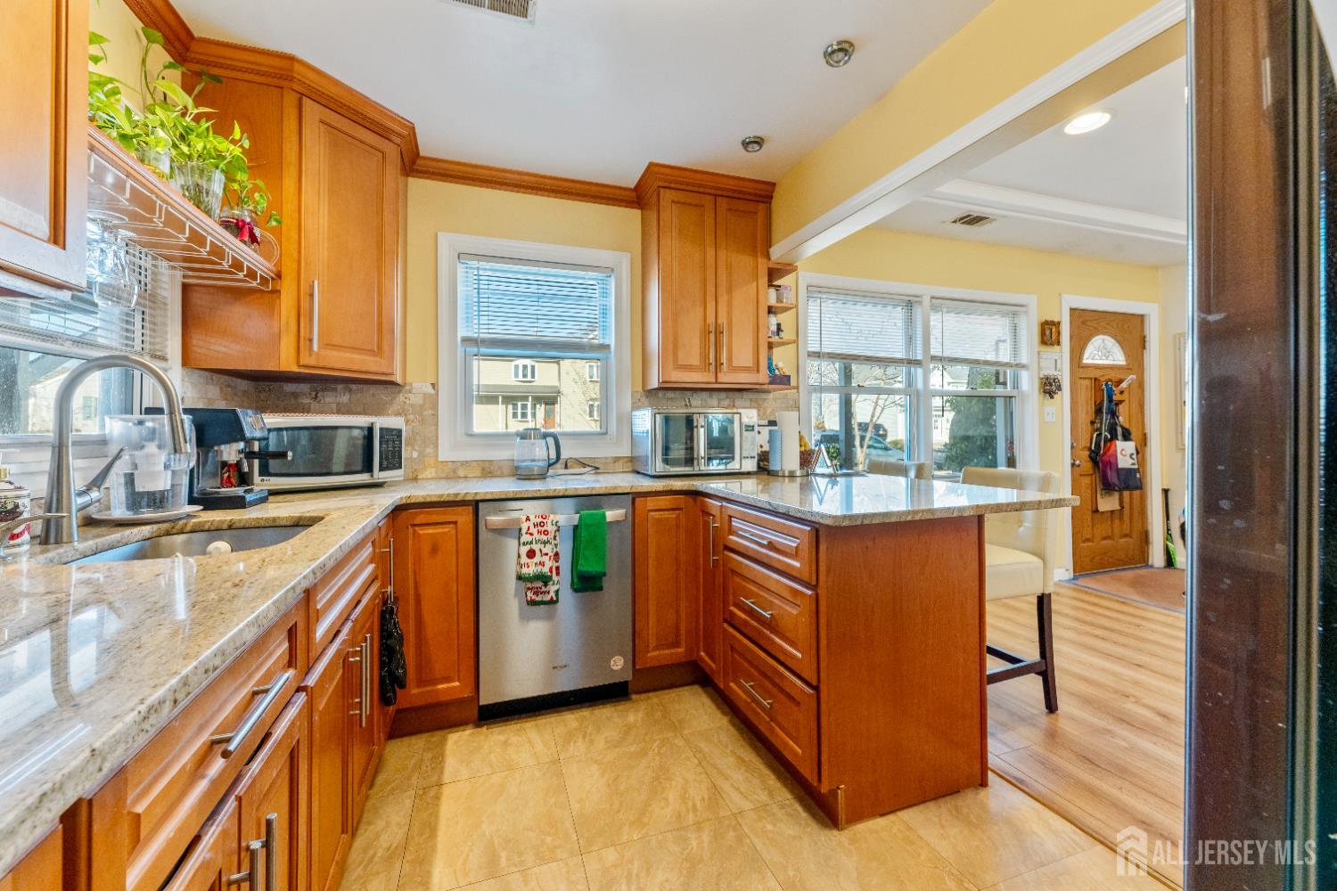 46 Runyon Avenue Edison, NJ 08817 - Photo 8 of 48 a kitchen with stainless steel appliances granite countertop a stove a sink and a refrigerator