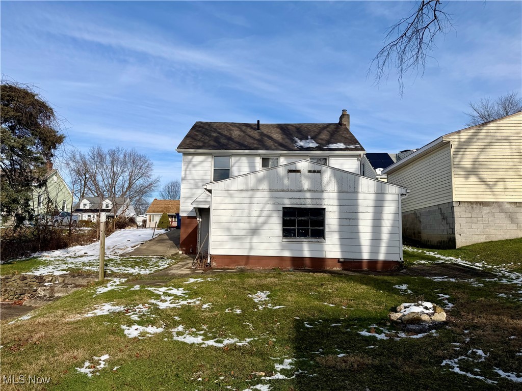 34 West Lewis Street Struthers, OH 44471 - Photo 14 of 14 Snow covered property with a chimney and a yard