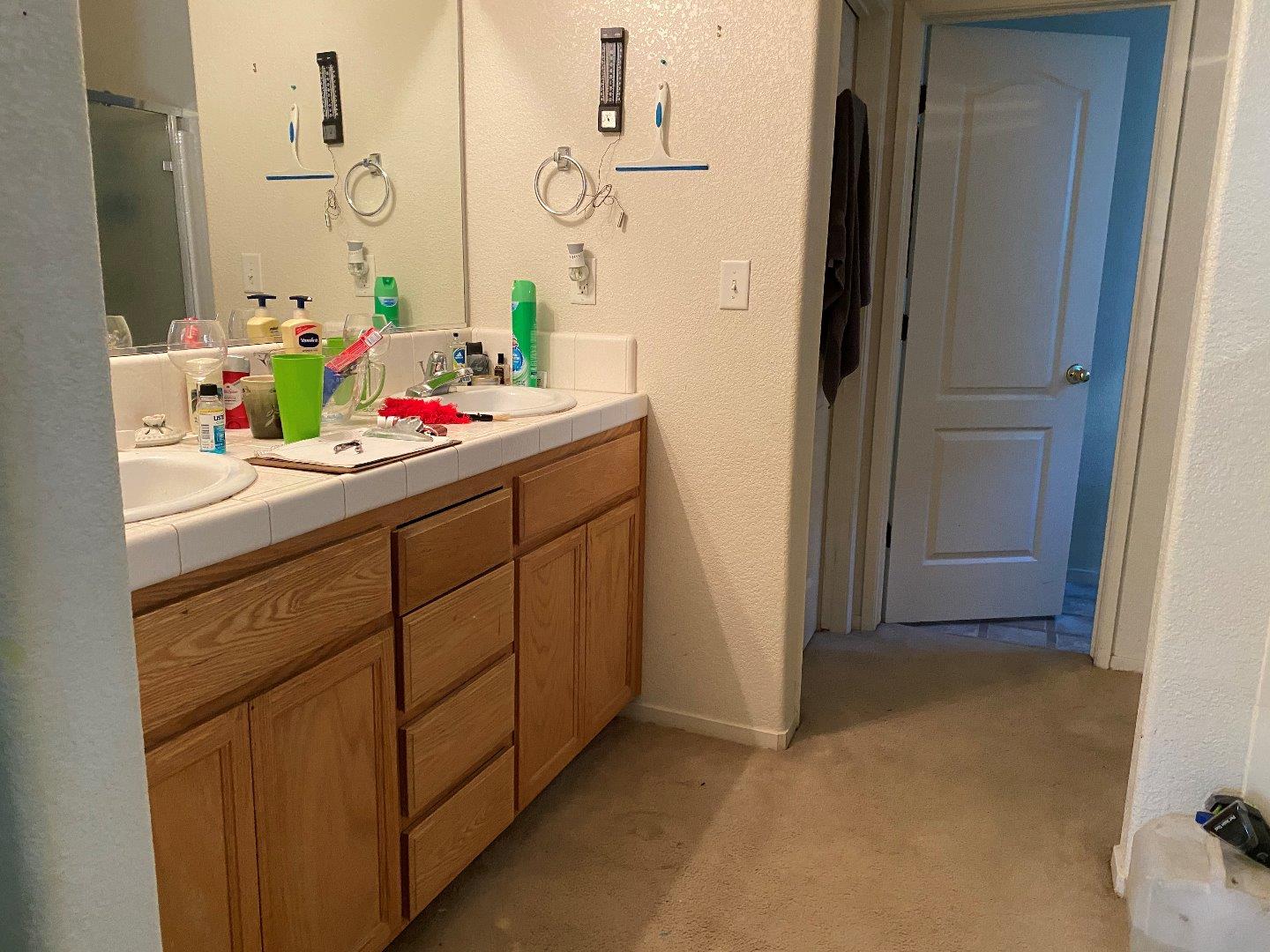 1431 Cardinal Street Los Banos, CA 93635 - Photo 8 of 10 a bathroom with a sink vanity and a mirror