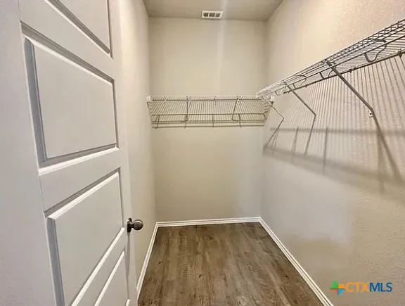 a view of a room with racks on the wall