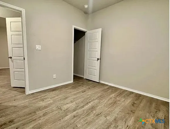 an empty room with closet area