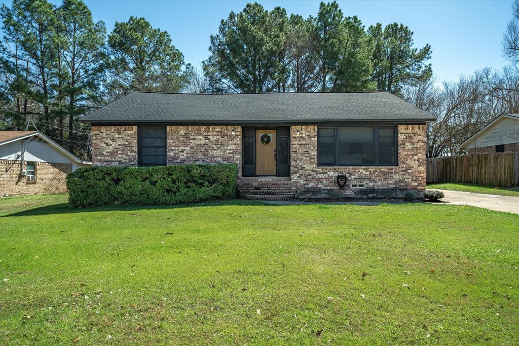 1460 Forrest Drive Canton, TX 75103 - Photo 2 of 36 a front view of a house with garden