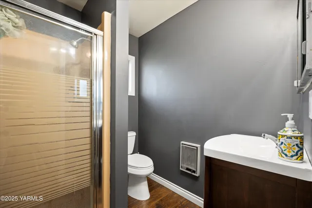 a white toilet sitting next to a bathroom sink