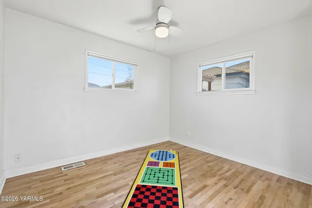 a room with window and ceiling fan