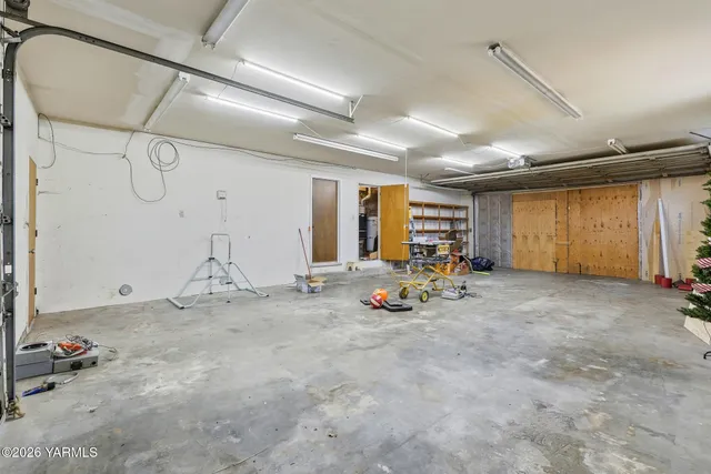 a view of a house with a yard and a garden