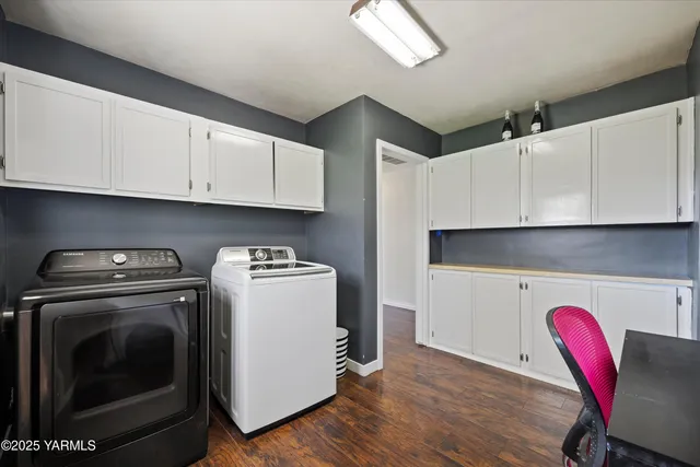 a view of kitchen with sink and cabinets