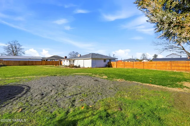 a view of a pool with a yard