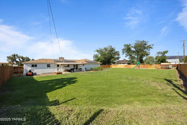a view of a house with a big yard