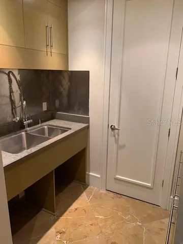 a kitchen with a sink and cabinets