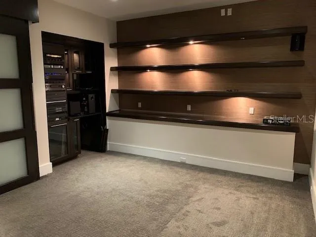 a kitchen with refrigerator and stove