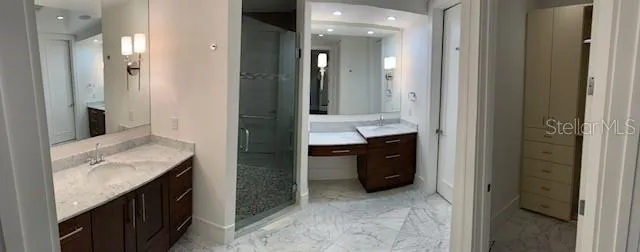 a bathroom with a double vanity sink and a mirror
