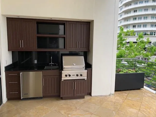 a kitchen with a cabinets and a stove top oven