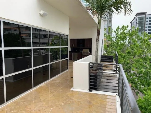 a view of stairs with wooden floor and potted plants
