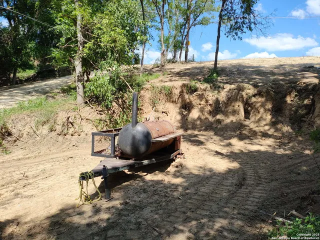 a view of a backyard of the house