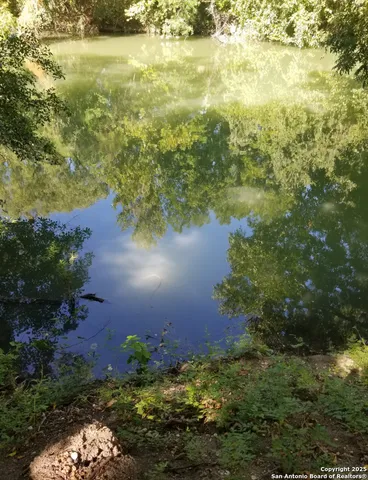a view of lake with green space