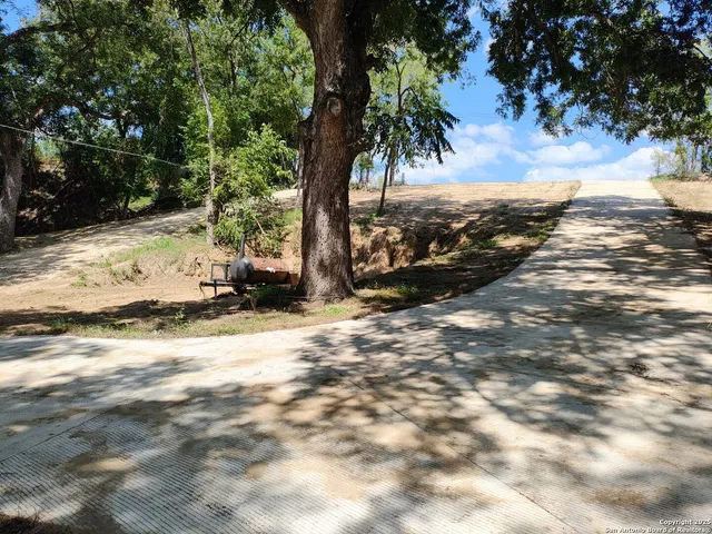 a view of a backyard of a house