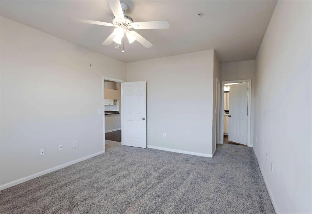 10505 I-35 Frontage Road South, Unit 2432 Austin, TX 78747 - Photo 16 of 22 a view of an empty room with a ceiling fan