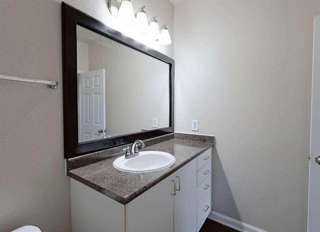 10505 I-35 Frontage Road South, Unit 2432 Austin, TX 78747 - Photo 18 of 22 a bathroom with a sink vanity and a mirror