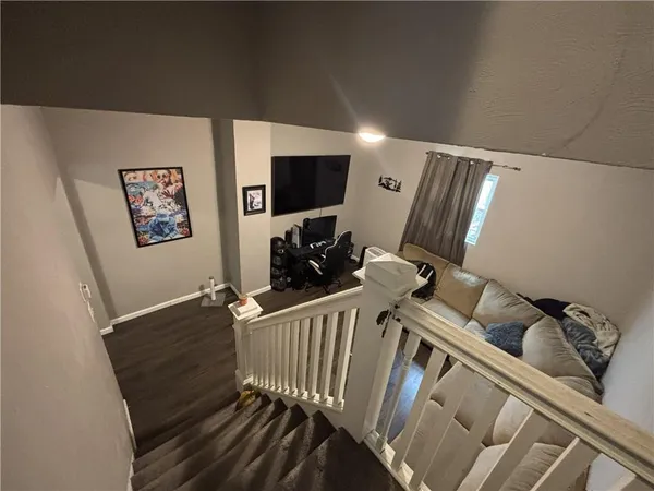 a view of livingroom with furniture and workspace