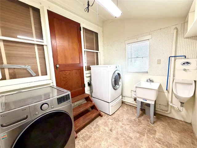 a utility room with dryer and washer