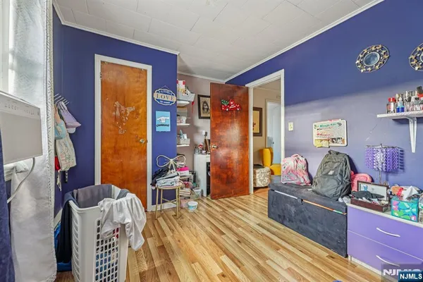 a bed room with a bed and a tv