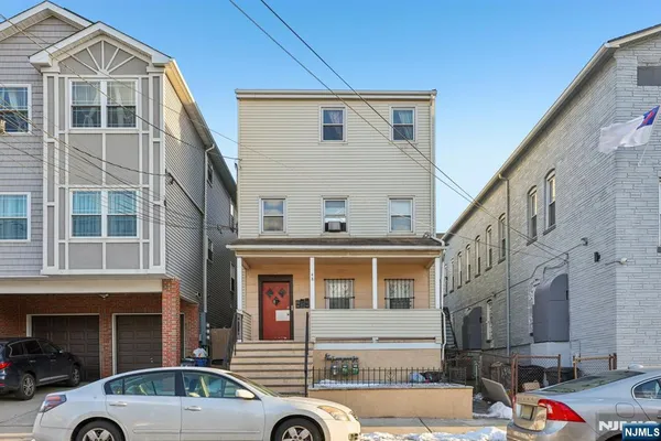 a front view of a house with parking space