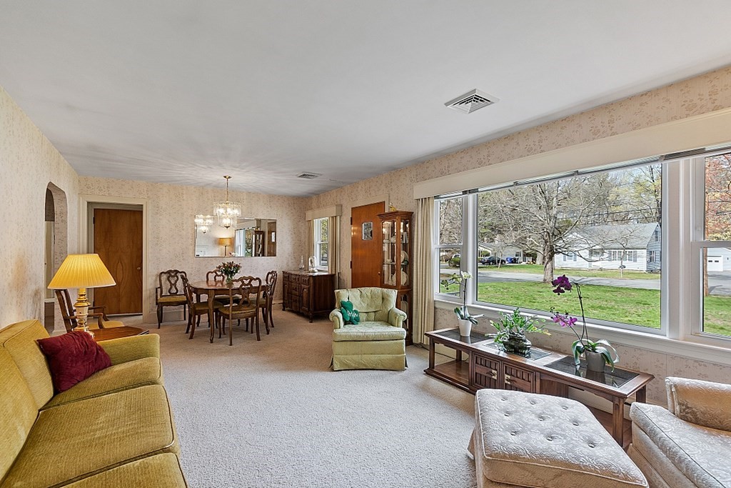 61 Harvard Road Shirley, MA 01464 - Photo 12 of 42 a living room with furniture and a large window