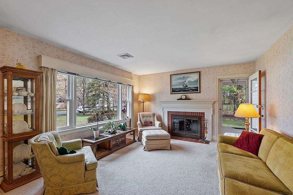 61 Harvard Road Shirley, MA 01464 - Photo 13 of 42 a living room with furniture and a fireplace