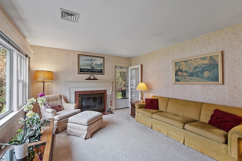 61 Harvard Road Shirley, MA 01464 - Photo 16 of 42 a living room with furniture and a fireplace
