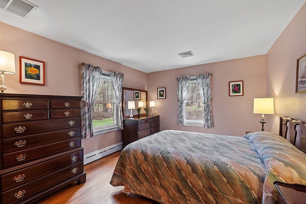 61 Harvard Road Shirley, MA 01464 - Photo 18 of 42 a bedroom with a bed and a dresser