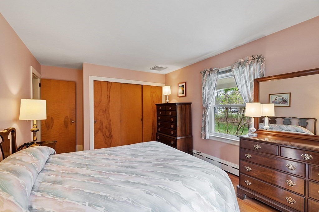 61 Harvard Road Shirley, MA 01464 - Photo 19 of 42 a bedroom with a large bed and a dresser
