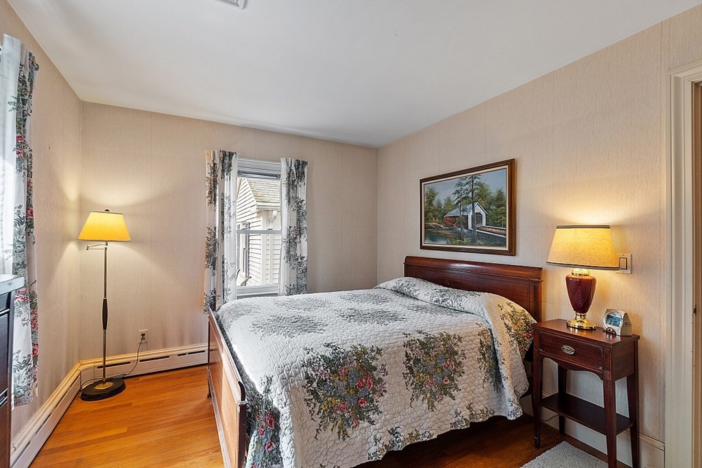 61 Harvard Road Shirley, MA 01464 - Photo 22 of 42 a bedroom with a bed lamps and window