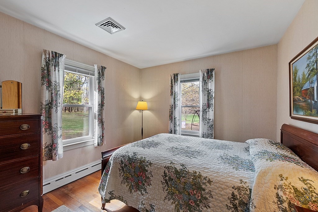 61 Harvard Road Shirley, MA 01464 - Photo 23 of 42 a bedroom with a bed and a window
