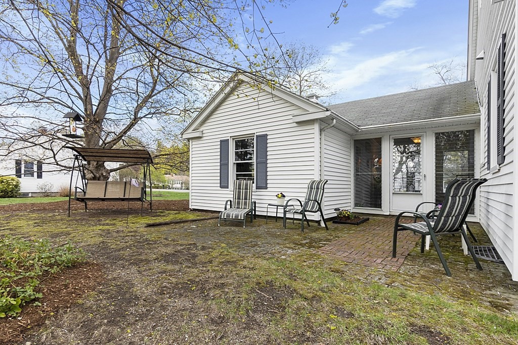 61 Harvard Road Shirley, MA 01464 - Photo 33 of 42 a backyard of a house with table and chairs