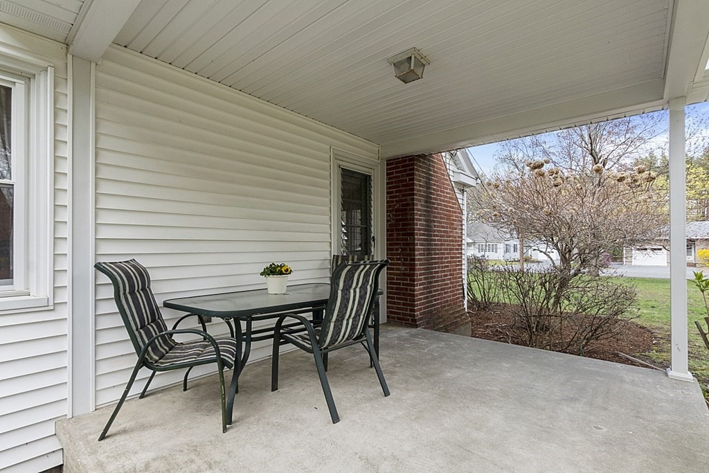 61 Harvard Road Shirley, MA 01464 - Photo 35 of 42 a backyard of a house with table and chairs