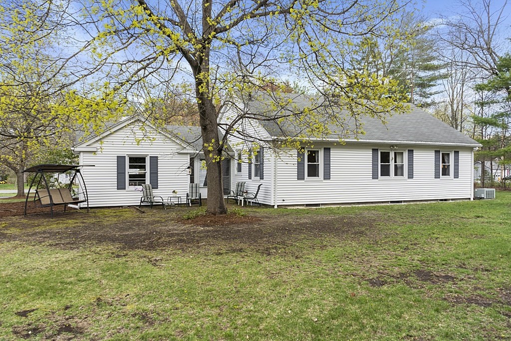 61 Harvard Road Shirley, MA 01464 - Photo 36 of 42 a front view of a house with a garden